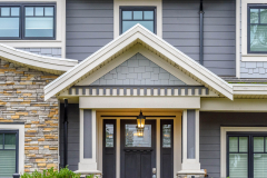 A perfect neighborhood. Houses in suburb at Fall in the north America. Fragment of a luxury house wi