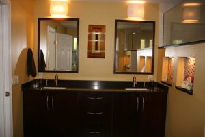 A beautiful washroom with two golden lights