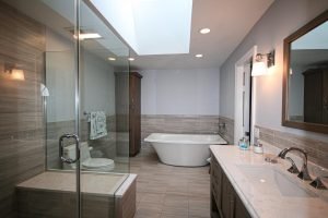 Interior view of luxury bathroom with white color bathtub.