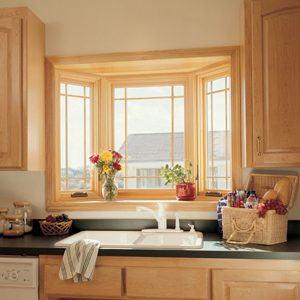 Replacement Windows behind a white kitchen sink